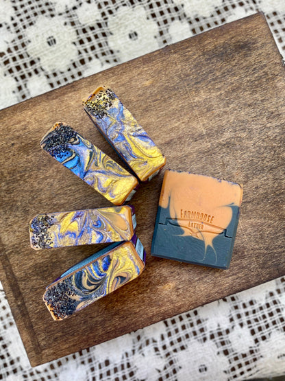 Scented soap bars arranged on tray, blue marbled tops and tan label