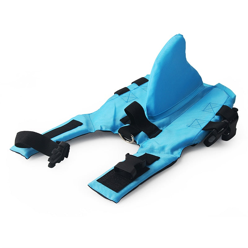 Dog life vest in blue with black adjustable straps and front D-ring