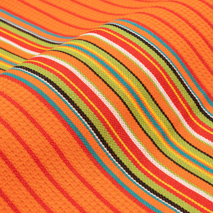 Striped kitchen towel fabric close-up in orange with red, green, blue, and white stripes