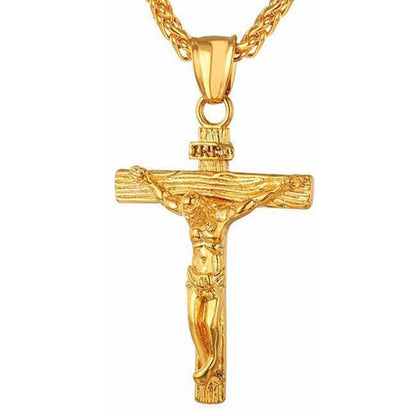 Gold cross pendant necklace with crucifix design and curb chain