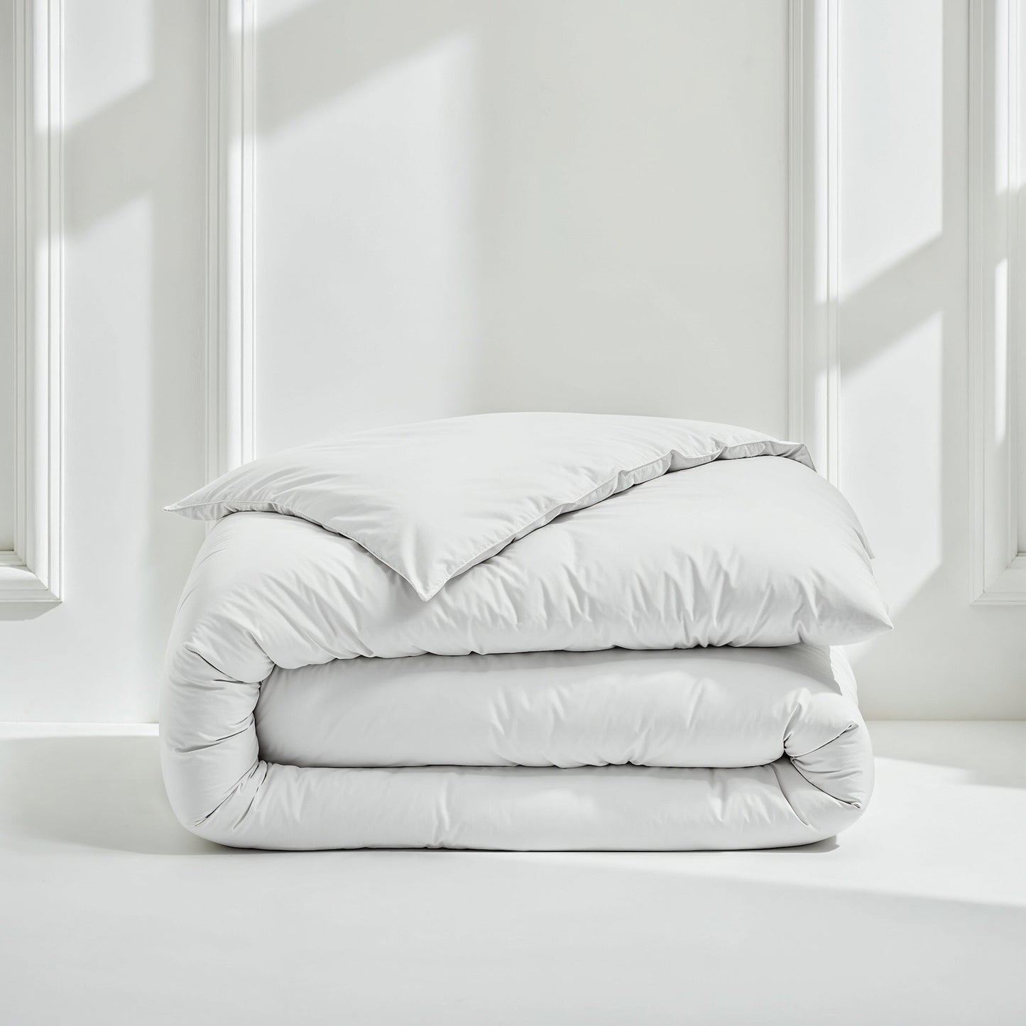 White sateen bedding bundle with a folded duvet and two pillows