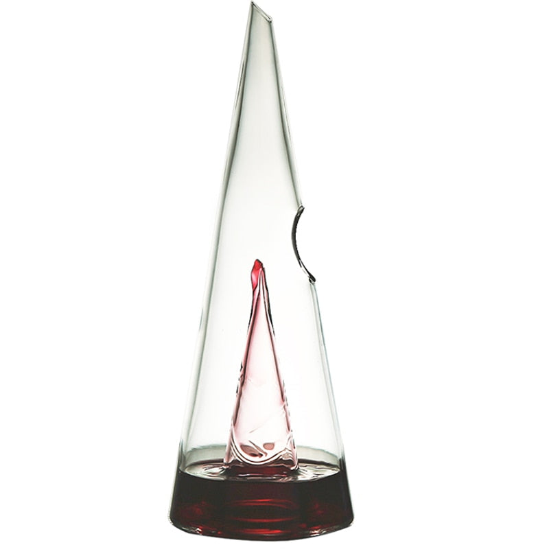 Transparent wine decanter, tall clear cone shape with red wine at the base
