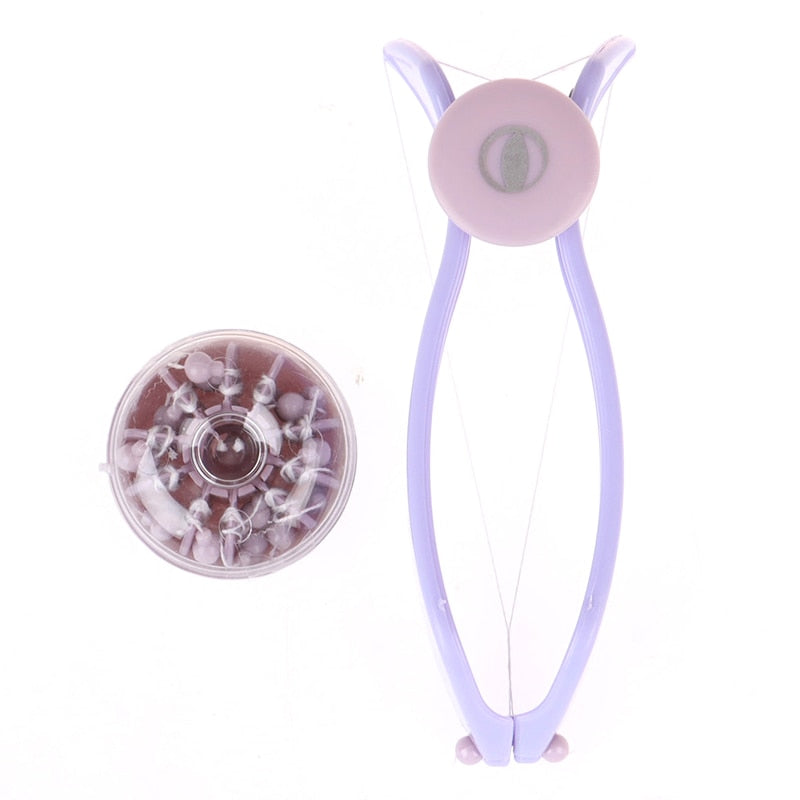 Purple handheld hair remover tool with circular head and suction-tweezer disk