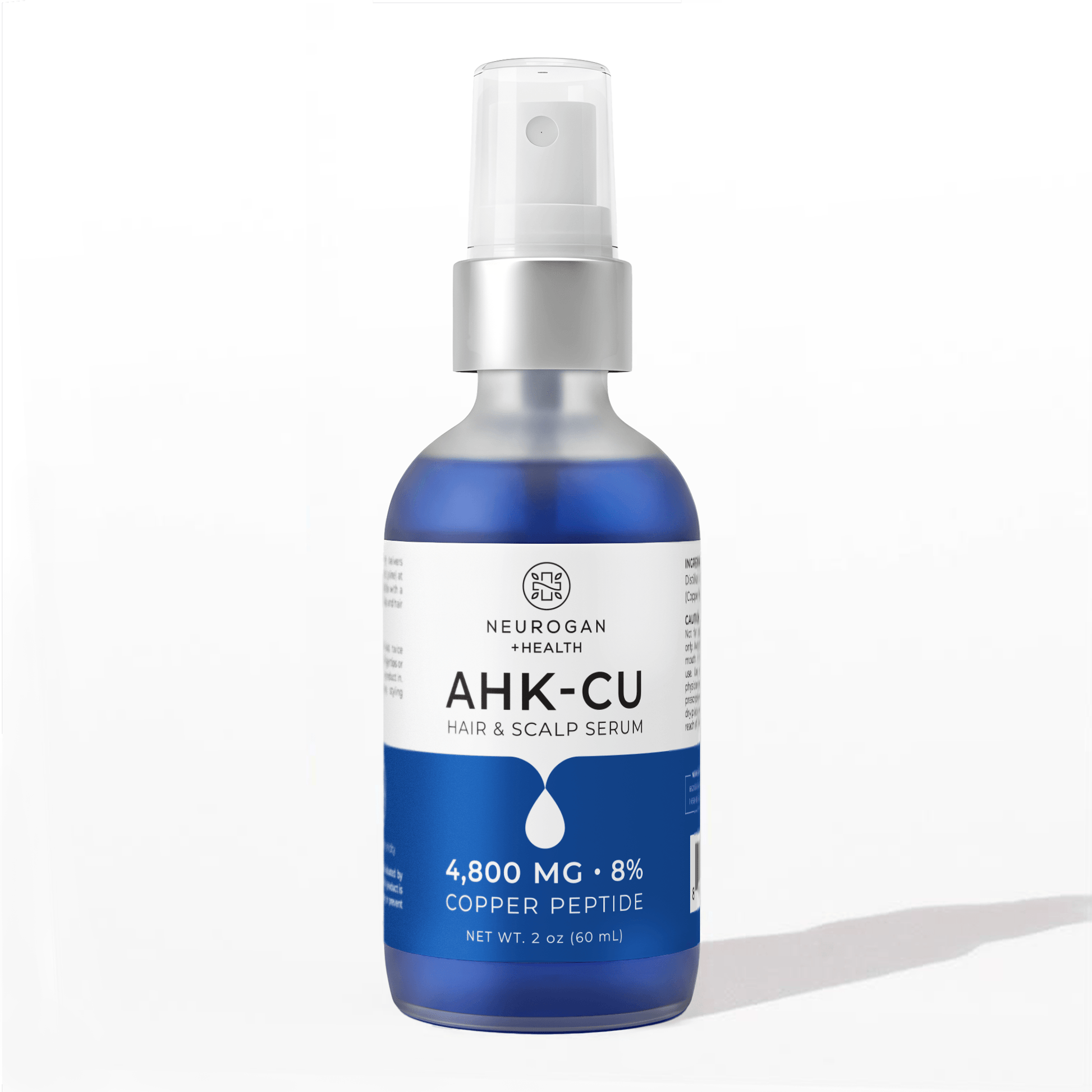 AHK-Cu hair & scalp serum bottle with blue liquid and white spray pump.