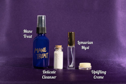 Mane Treat blue spray with powder vial, clear gold-capped mist bottle, and cream pot