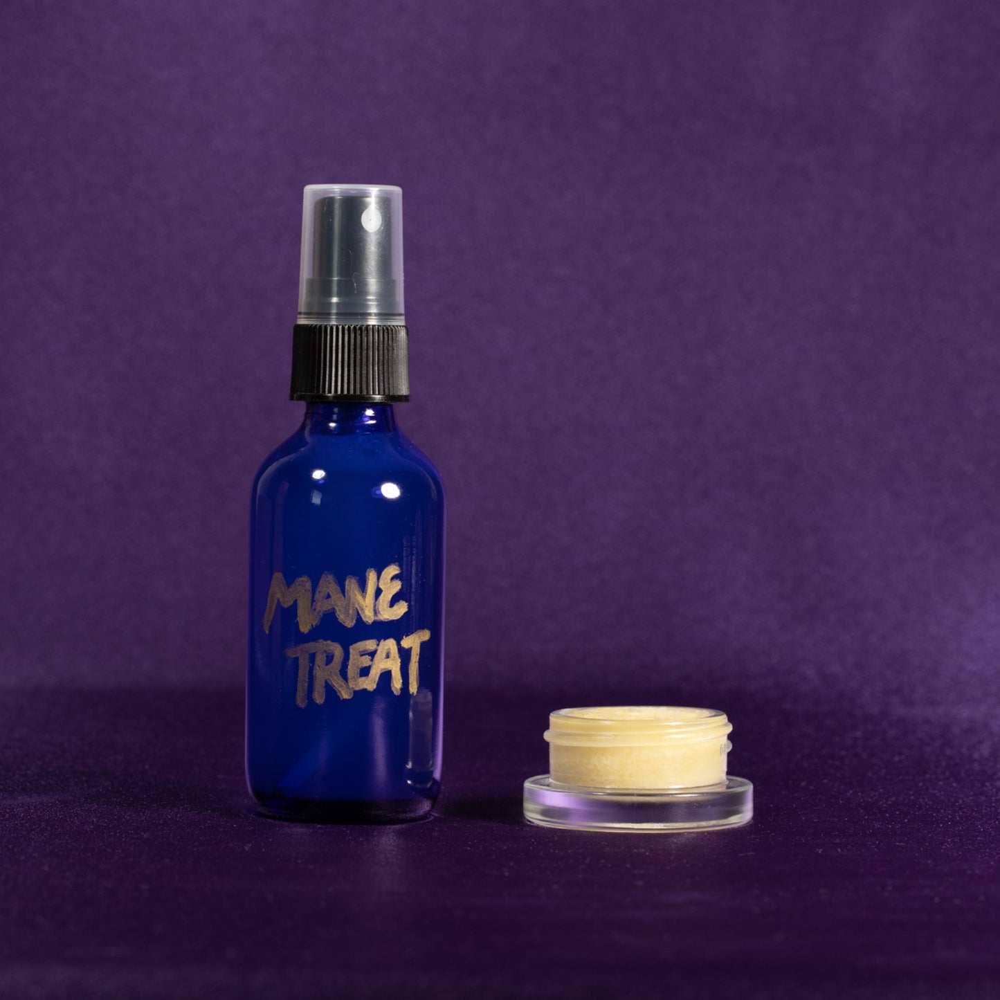Blue Mane Treat spray bottle with silver nozzle and cream jar on side