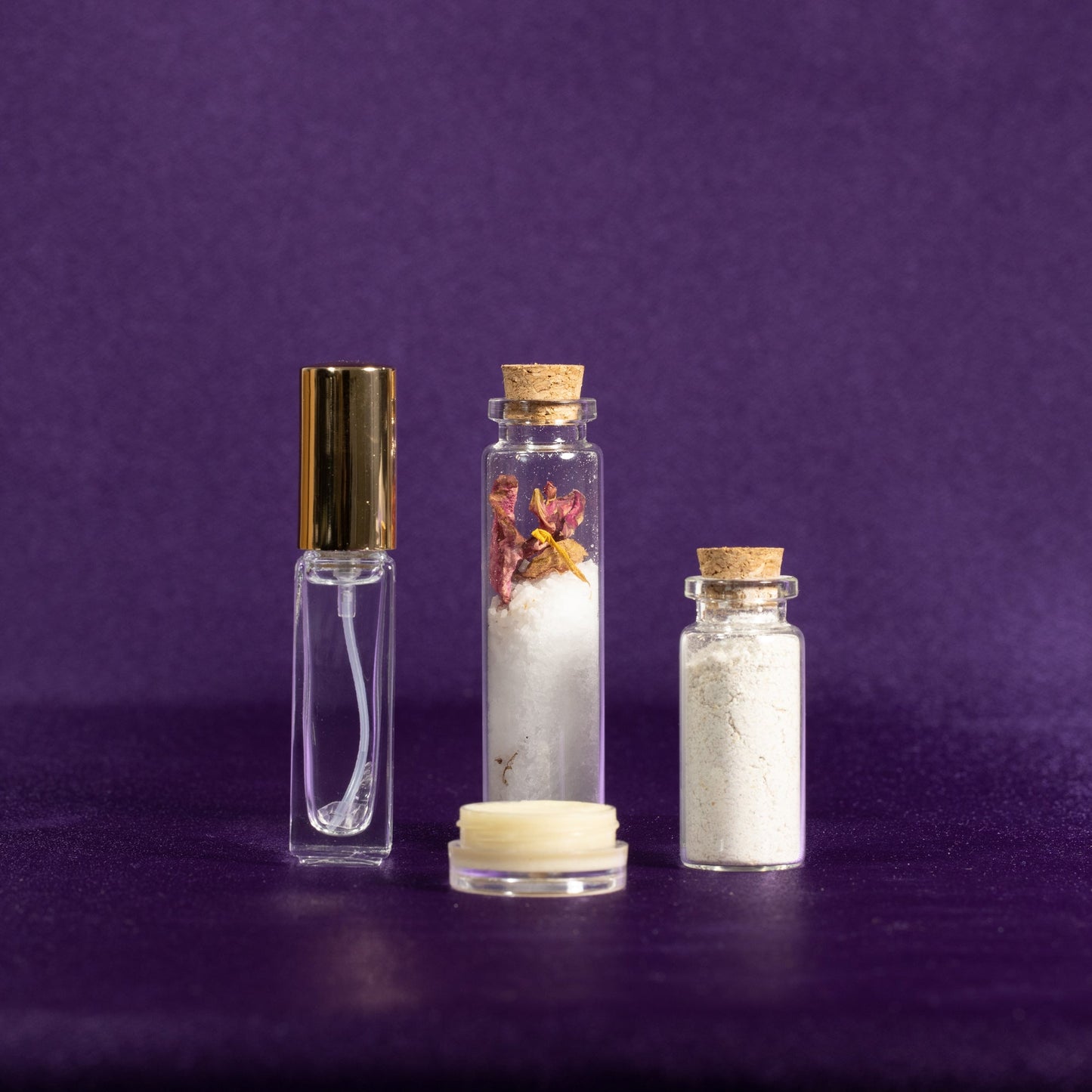 Spa gift set featuring two spritz bottles, a cream jar, and small jars of salts