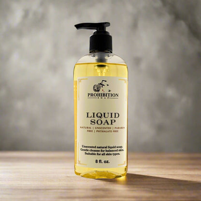 Liquid hand soap bottle with black pump, front label and clear yellow liquid