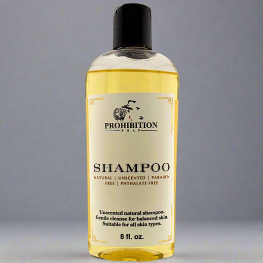 Shampoo bottle with black cap and yellow-gold front label, 8 fl oz