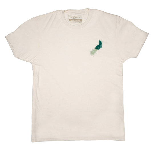 Off-white T-shirt with small teal bird graphic on chest