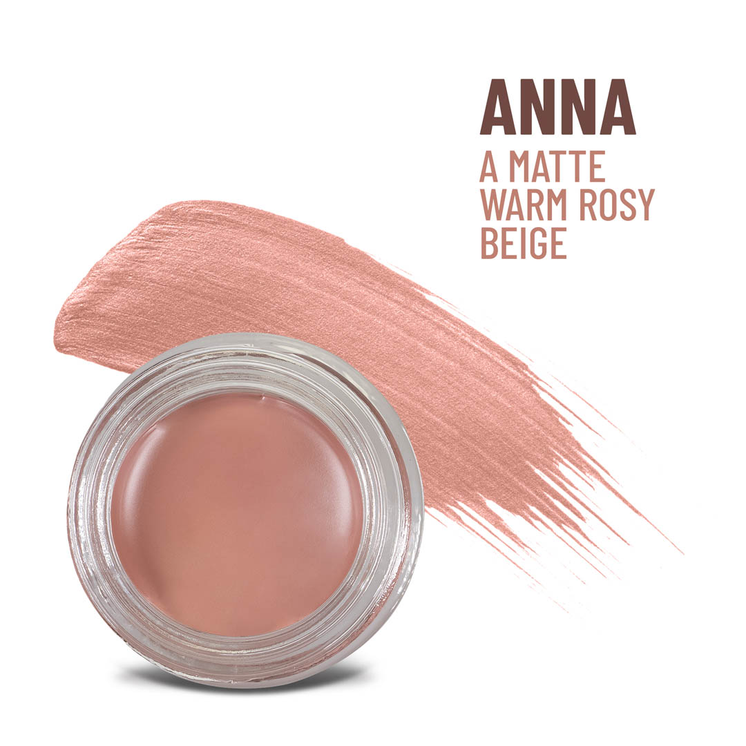 Warm rosy beige cream-to-powder in clear round jar with open lid, matte finish