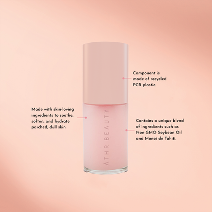 Aurora Glow lip oil bottle with light-pink label and printed directions on side