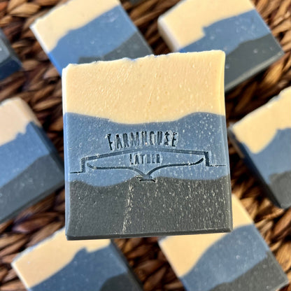 Marbled soap bar, pale cream and dark blue with stamped label on front