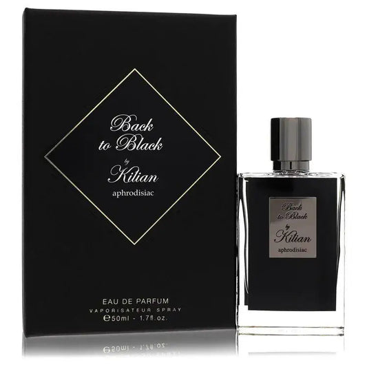 Eau de parfum bottle beside black gift box with gold diamond emblem