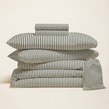 Striped bedding bundle with folded duvet, pillow shams, and extra matching pillowcase