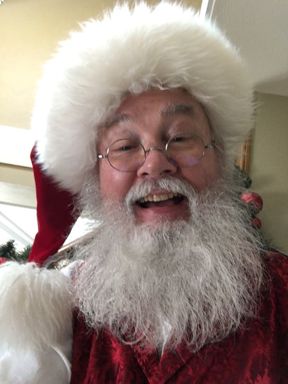 Organic beard oil; man with white beard wearing fluffy white hat, close-up