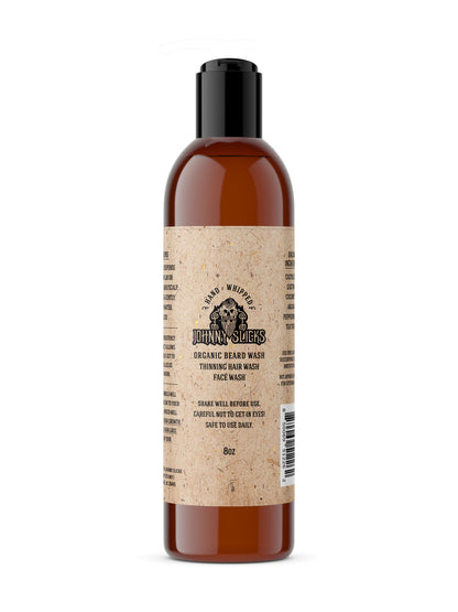 Organic whipped beard wash bottle, amber liquid, black cap