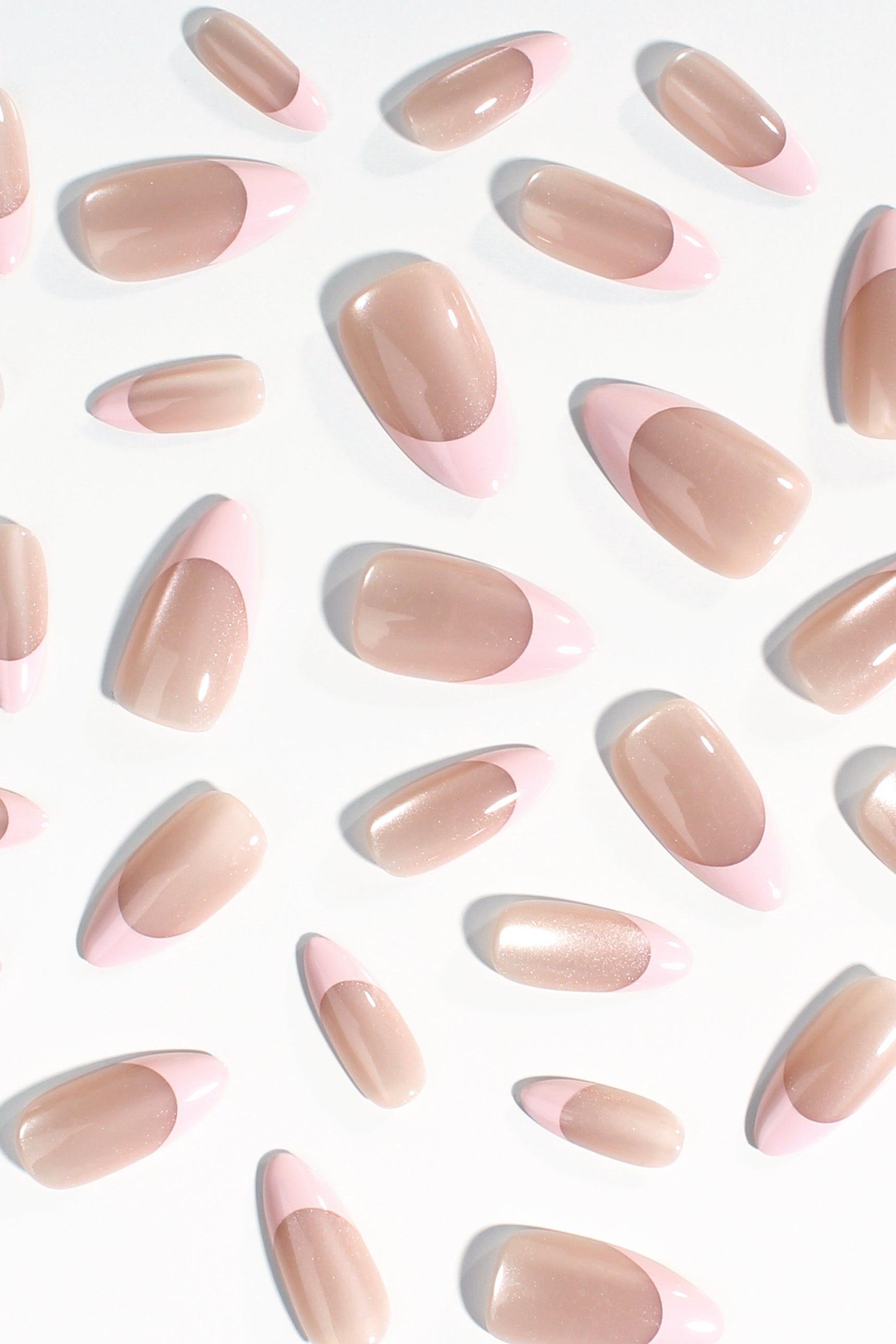 Assorted nude pink oval press-on nails with soft shine