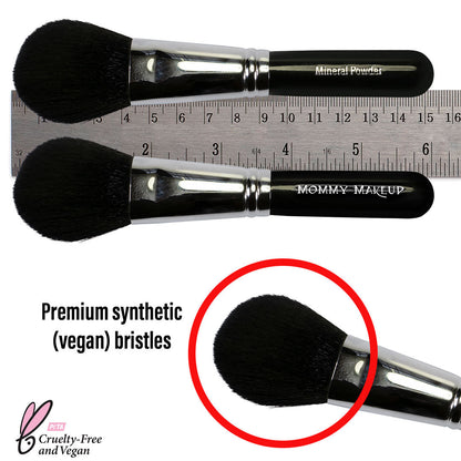 Mineral powder brush bristle end with soft black fibers and a chrome ferrule.