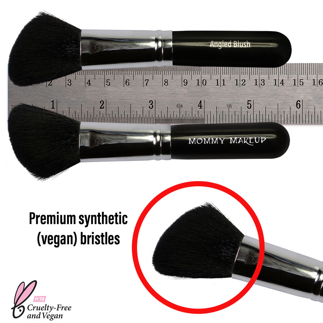 Angled blush brush with black handle; bristles shown next to a measuring ruler