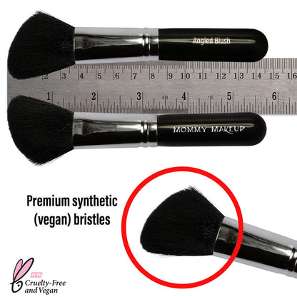 Angled blush brush with black handle; bristles shown next to a measuring ruler