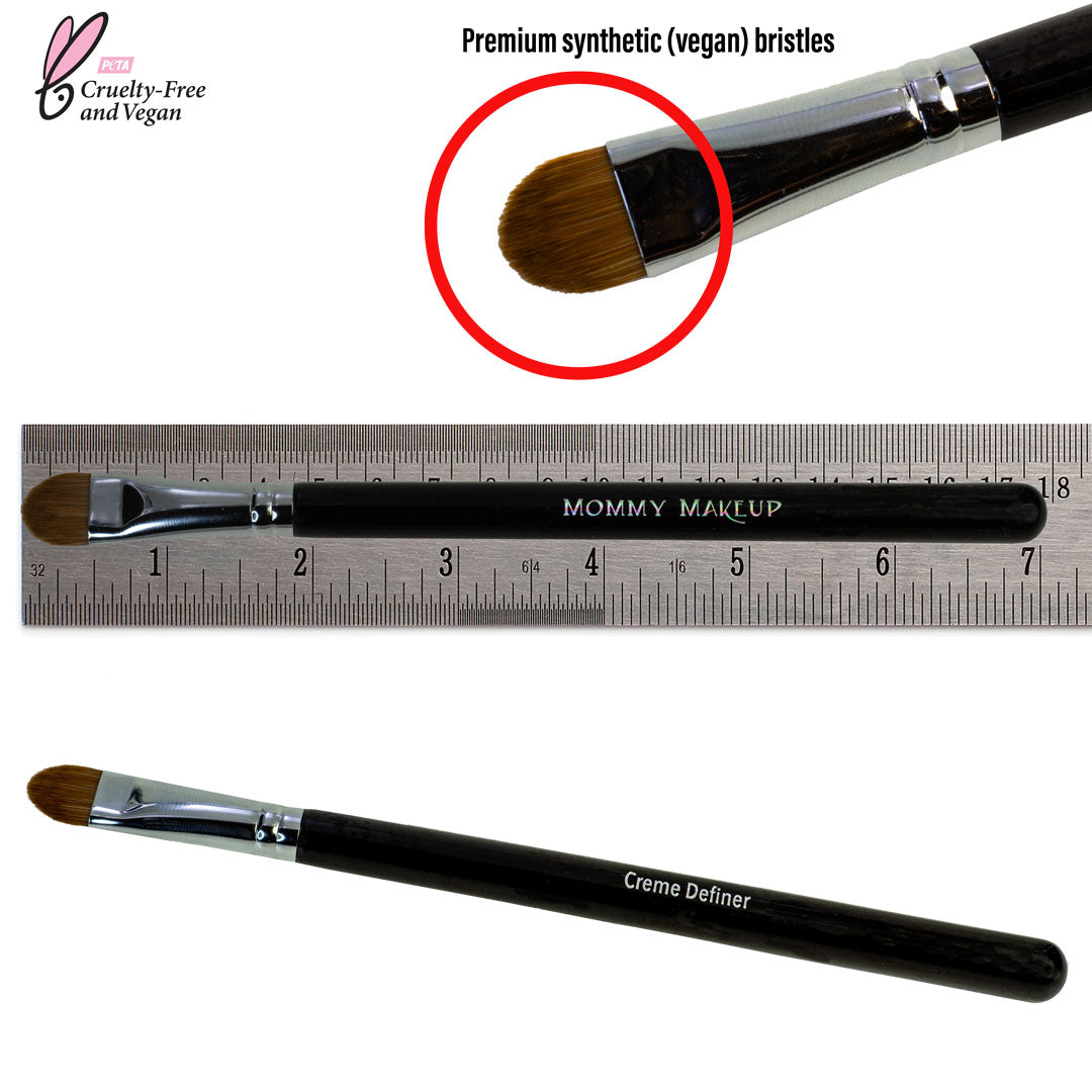Eyeliner brush with synthetic bristles and black handle, shown with measuring ruler