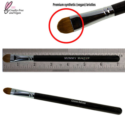 Eyeliner brush with synthetic bristles and black handle, shown with measuring ruler