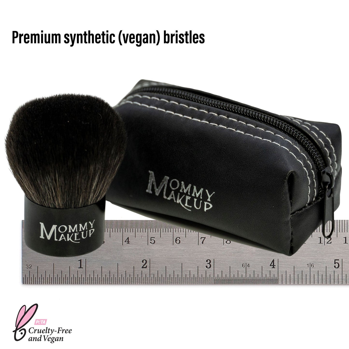 Kabuki makeup brush with black bristles, zip pouch and ruler for size