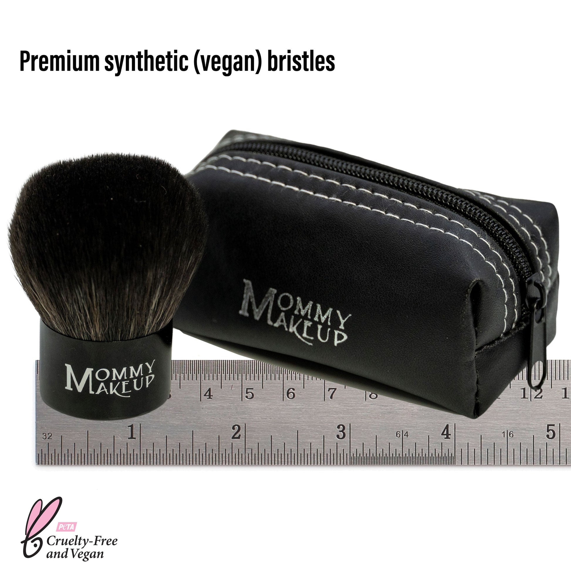 Kabuki makeup brush with black bristles, zip pouch and ruler for size