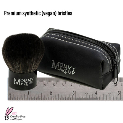 Kabuki makeup brush with black bristles, zip pouch and ruler for size
