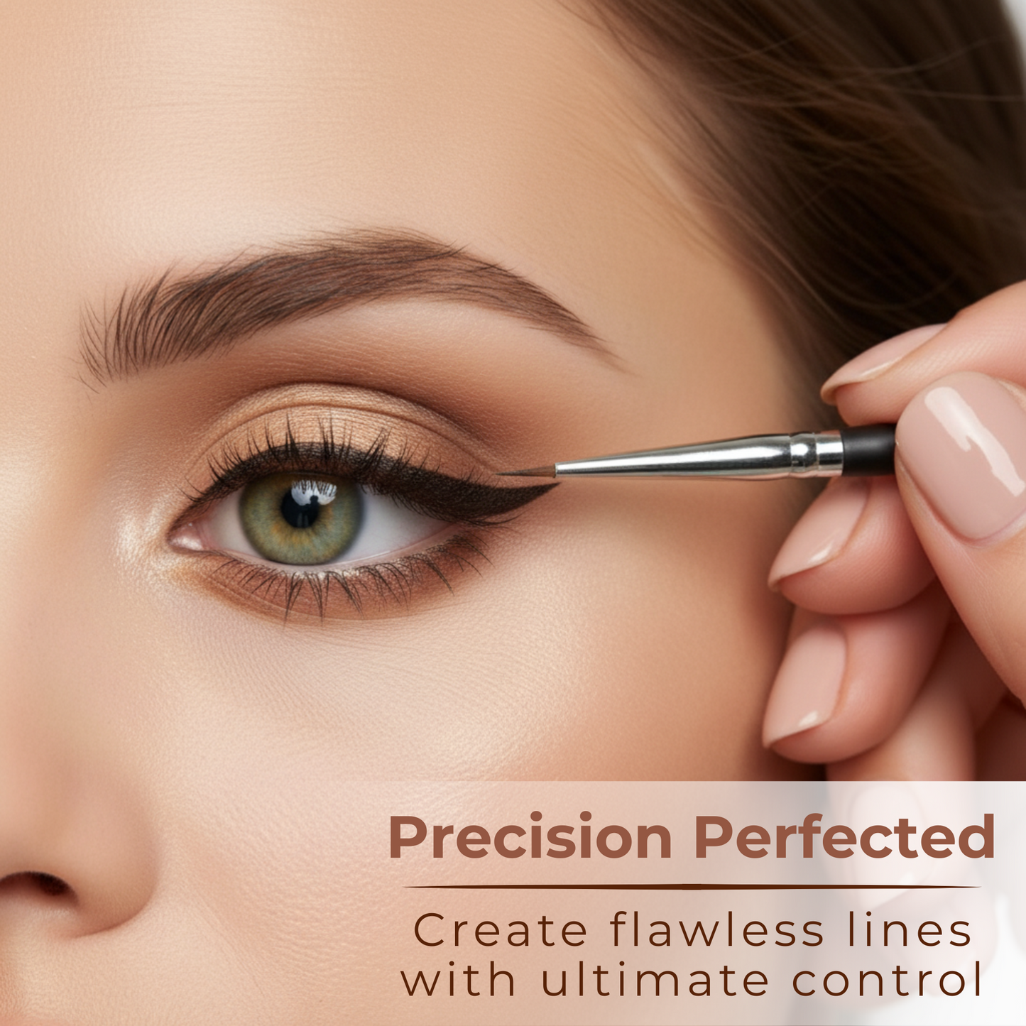 Pointed eyeliner brush applying liner near eye with tapered tip