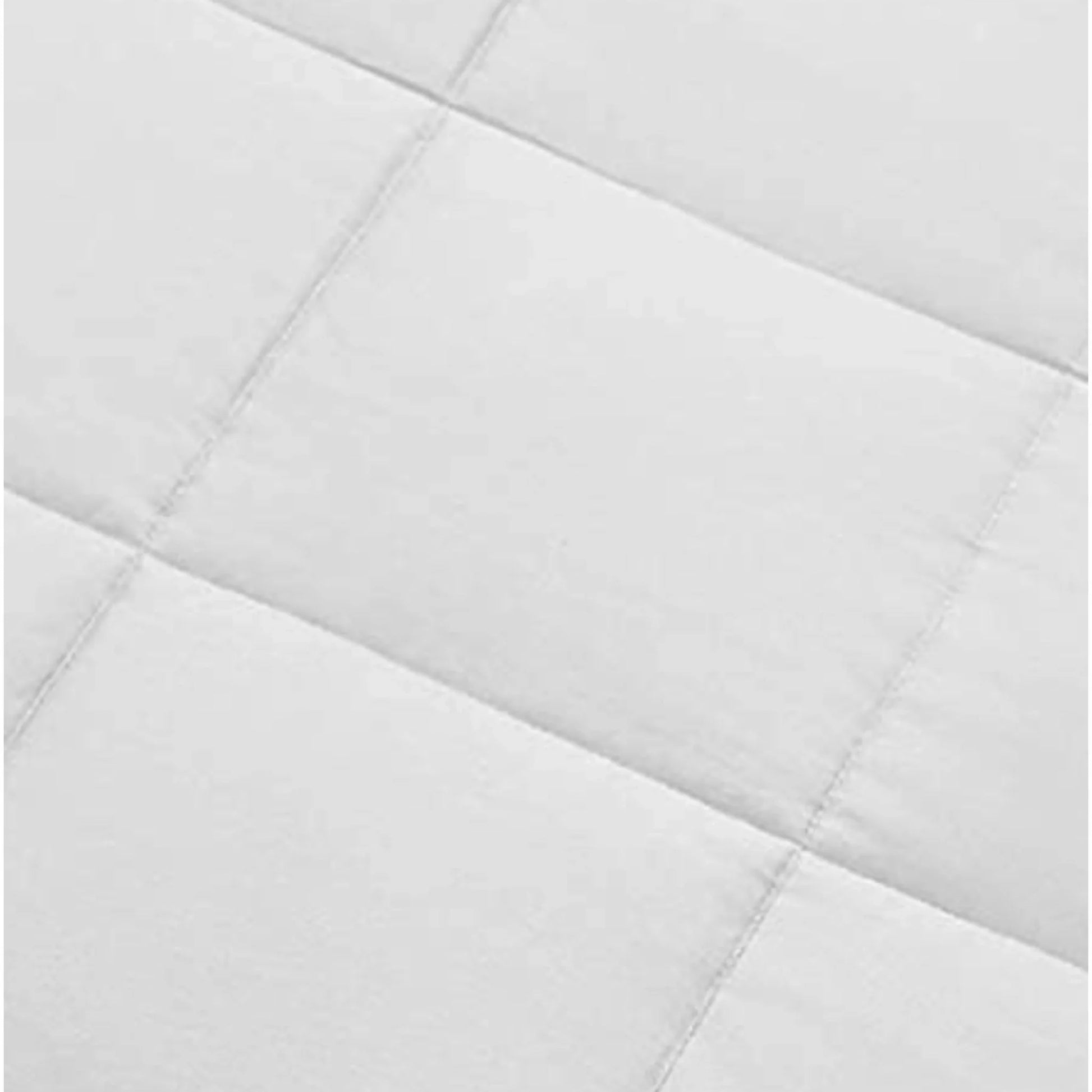 White duvet comforter close-up of stitched quilt channels and seam lines