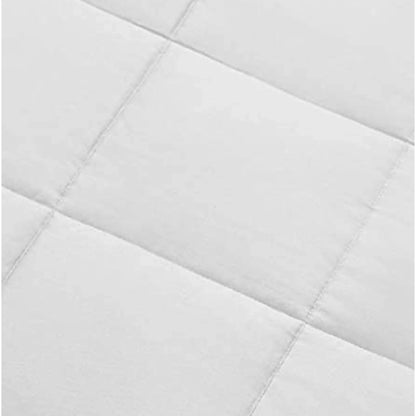 White duvet comforter close-up of stitched quilt channels and seam lines