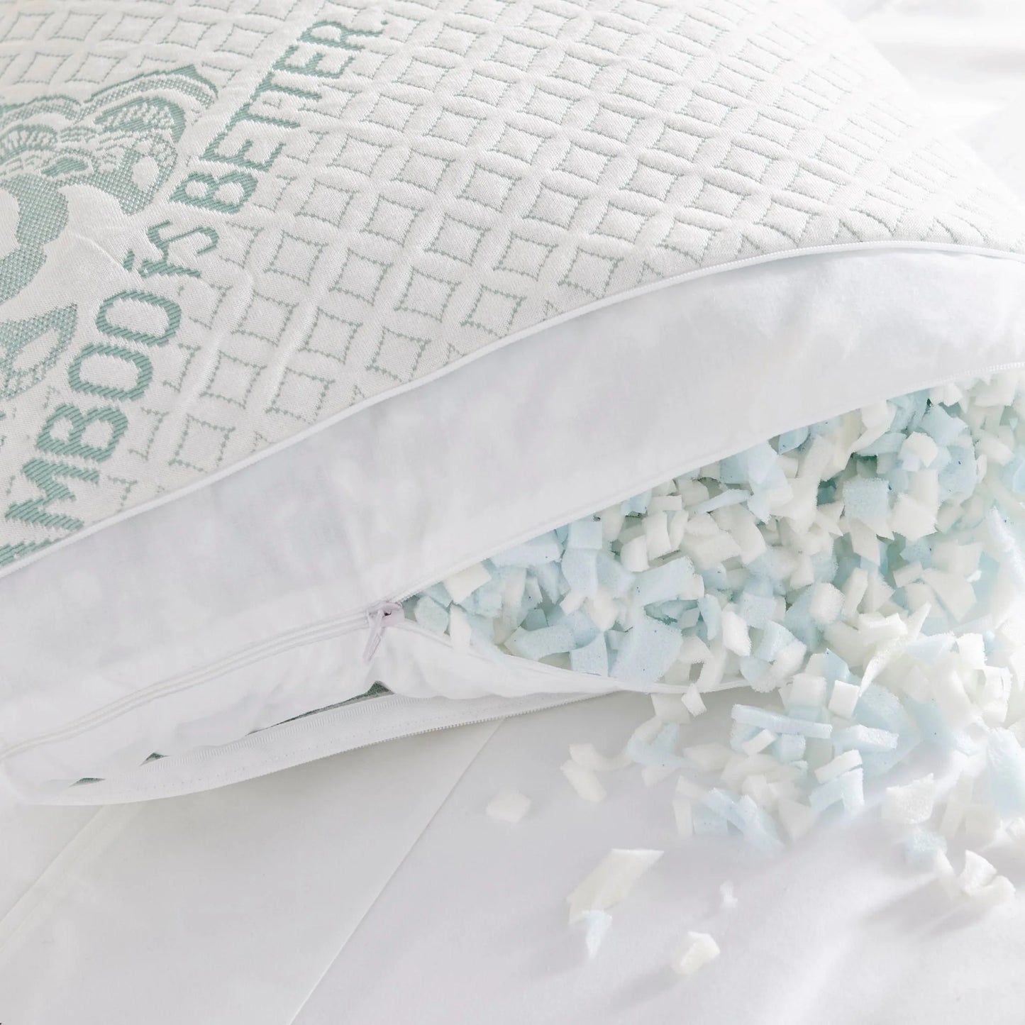 Adjustable cooling pillow with open zipper showing light mint shredded filling inside