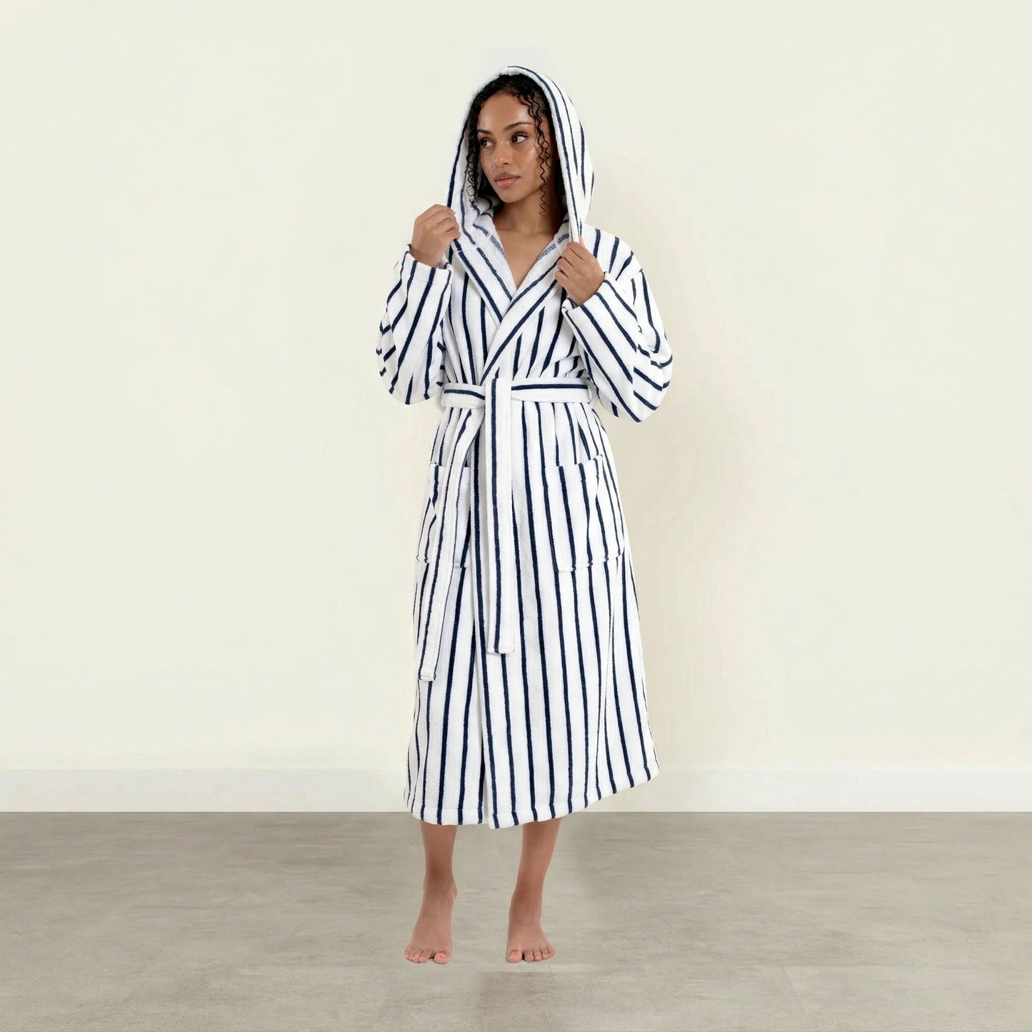 Striped cotton unisex bathrobe with hood and waist tie, long sleeves; white with blue stripes