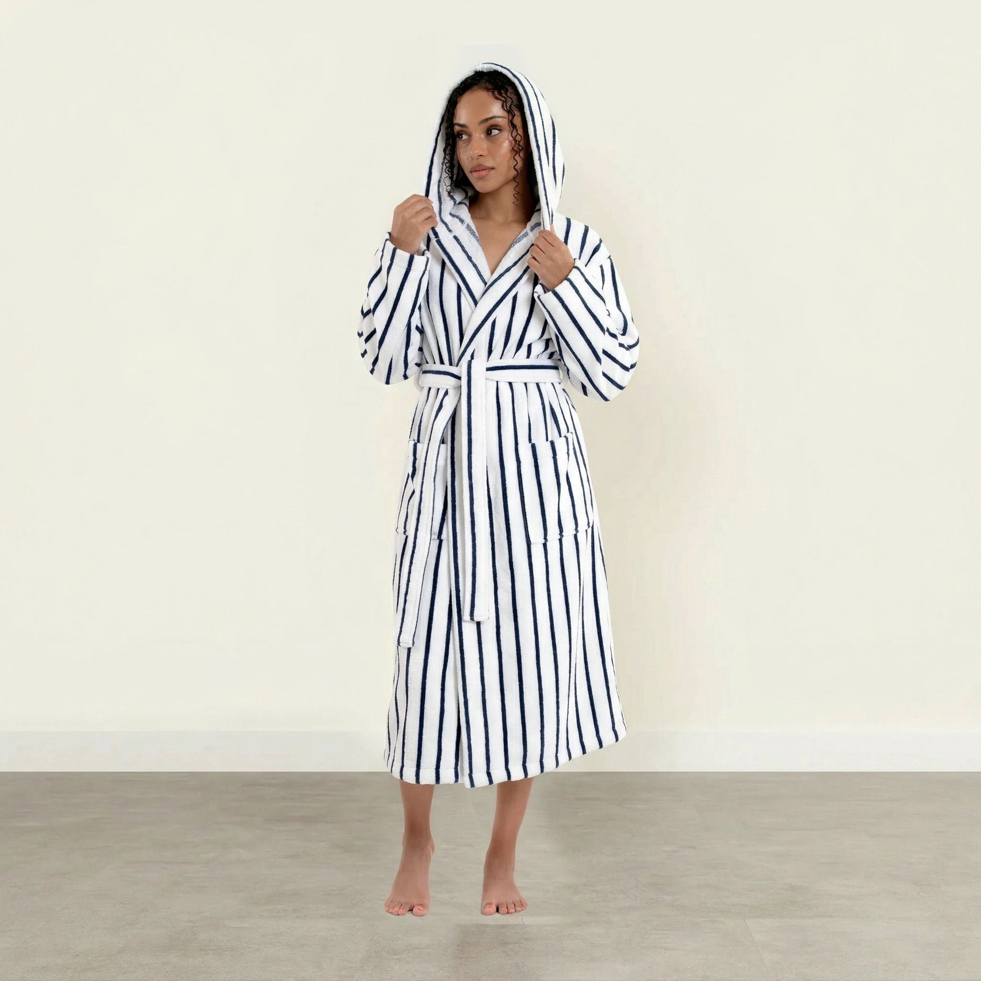 Striped cotton unisex bathrobe with hood and waist tie, long sleeves; white with blue stripes