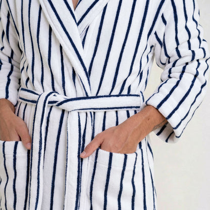 Cotton bathrobe close-up: striped fabric belt tie at waist and long sleeves; white/blue stripes