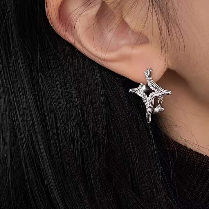 Silver rhinestone star cross earrings with dangling charms