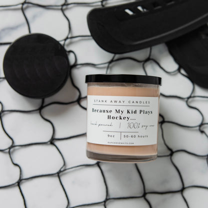 Natural soy wax candle in glass jar with pale beige wax and black lid