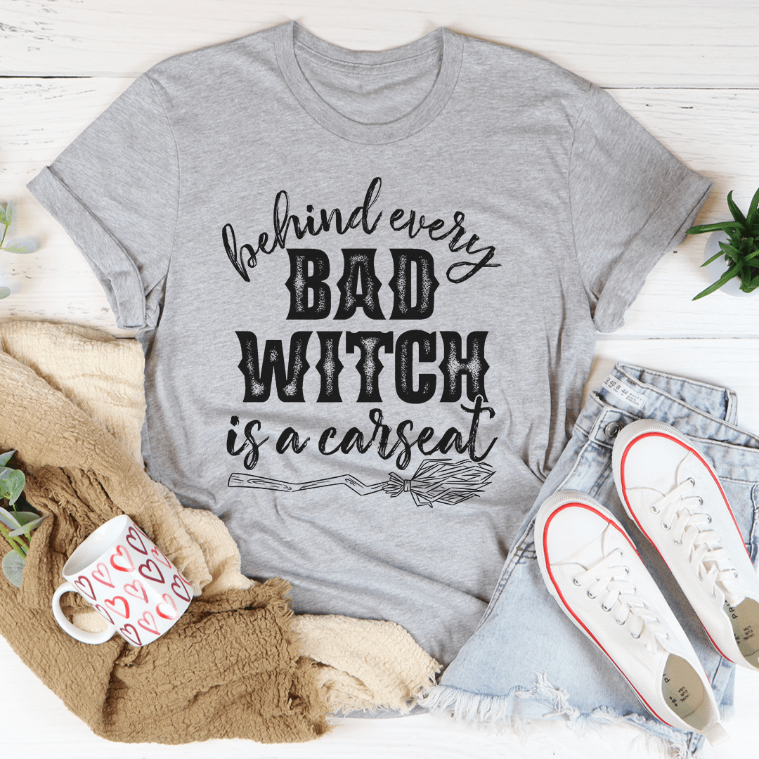 Behind Every Bad Witch Is A Car Seat T-Shirt - Renee Lane Company