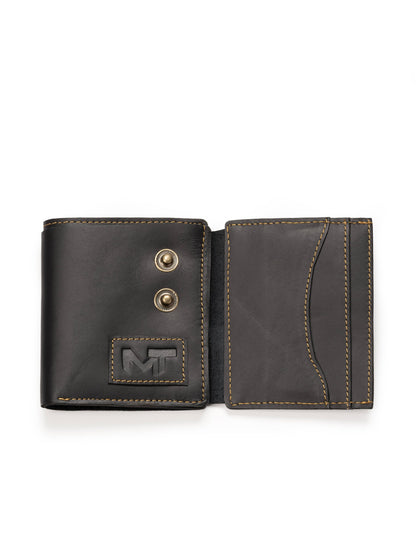 Black bifold leather wallet open, showing card pocket and snap button hardware