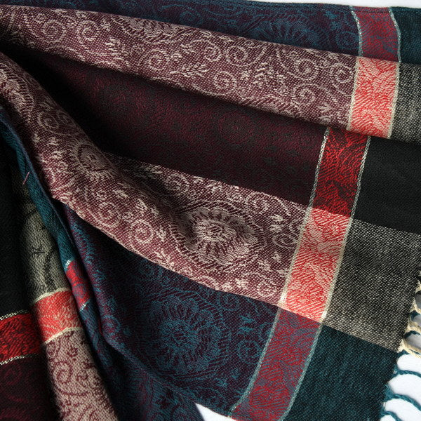 Pashmina scarf fabric detail with dark panel, teal and red plaid stripes