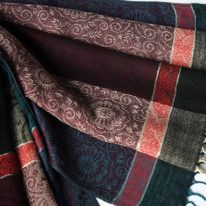 Pashmina scarf fabric detail with dark panel, teal and red plaid stripes