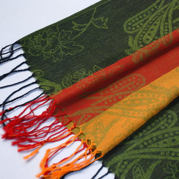 Paisley scarf close-up with dark green pattern and red, orange, yellow stripe section