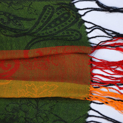 Paisley scarf fold detail with multicolor stripes and long black-and-red fringe tassels