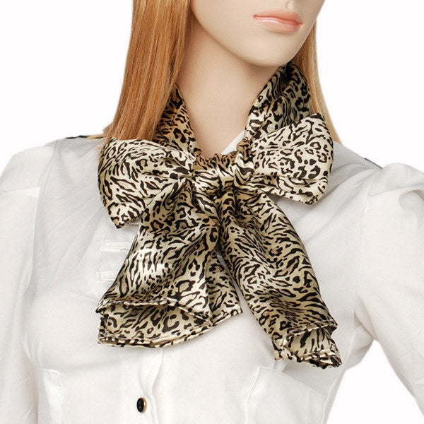 Silky scarf with leopard-and-zebra print, beige and dark, tied around neck
