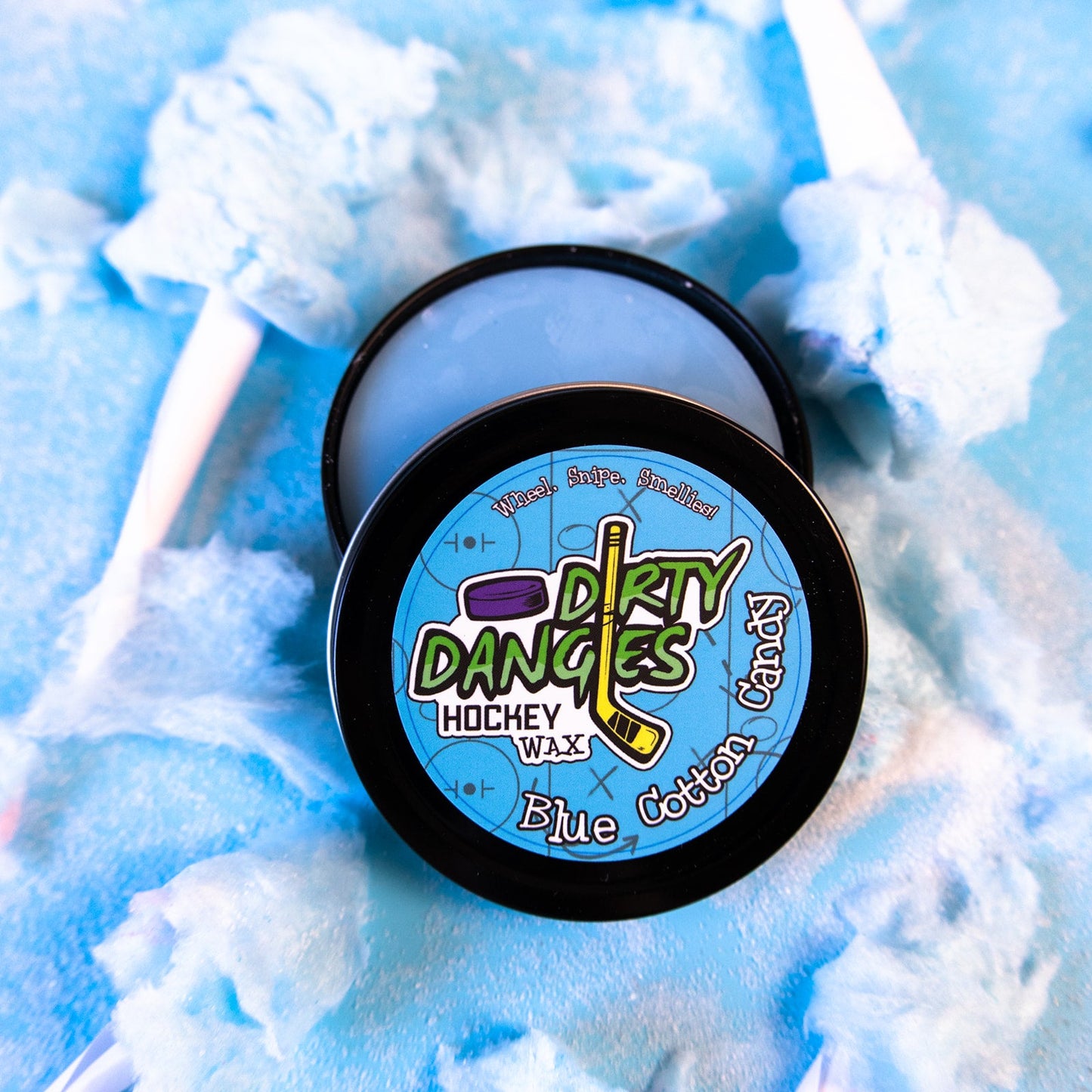 Hockey stick wax tin with round black lid and blue Dirty Danges label.