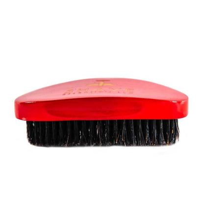 Red boar bristle hair brush with flat top and dark dense bristles
