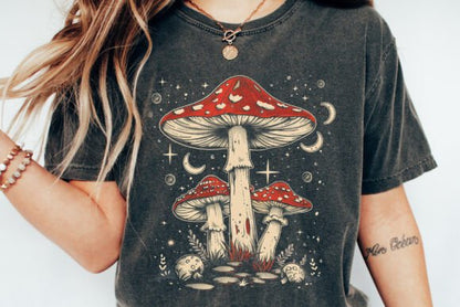 Unisex graphic t-shirt close-up in dark charcoal with red mushroom artwork