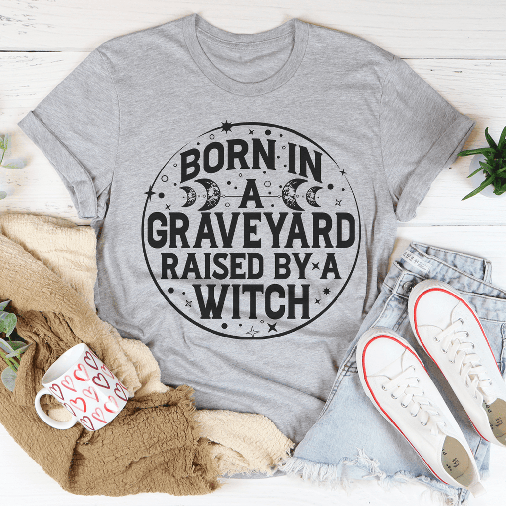 Born In A Graveyard Raised By A Witch T-Shirt - Renee Lane Company